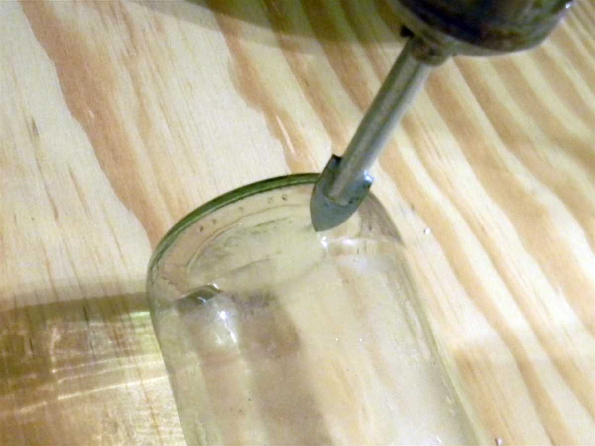 Q: Are there any safety precautions I should take when creating a hole in a glass bottle?