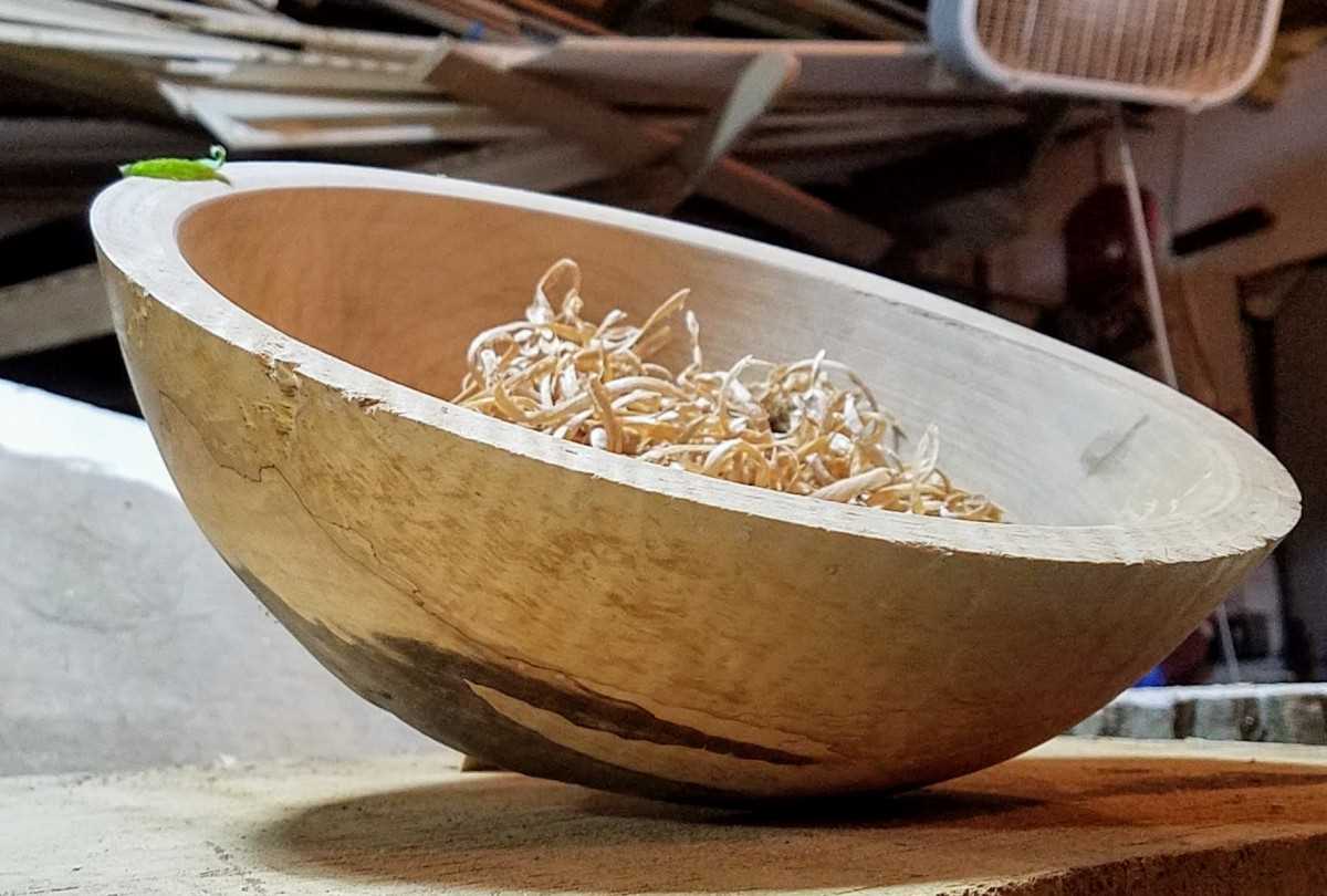 Begin the turning process by roughing out the shape of the bowl using a roughing gouge or a bowl gouge. Start by removing excess material from the outer edges, working your way towards the center. Take your time and pay attention to the grain of the wood to avoid tear-out or chipping. Once you have achieved the rough shape, switch to a smaller gouge or a spindle gouge for more detailed shaping and refining.