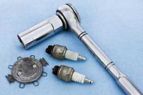 5. Replace spark plugs one at a time: