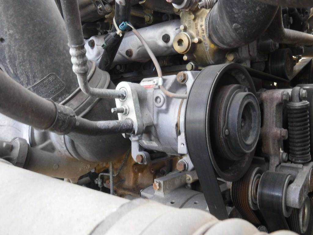 2. Look for the air compressor on the engine: